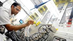 Argonne physicist Mahalingam Balasubramanian loads an in situ lithium-ion battery into the low-energy resolution inelastic X-ray (LERIX) system at the Advanced Photon Source. 