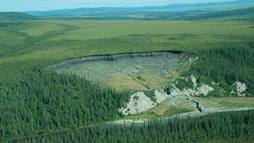 Large thermokarst disturbance along the Selawik River in Alaska. When these wedges of ice melt, the ground underneath them often collapses. 