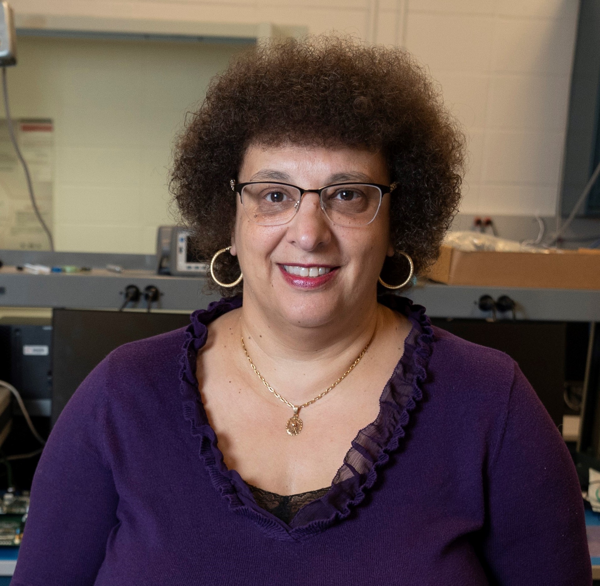 Mary Raafat Mikhail Bishai posing for a picture in a lab.